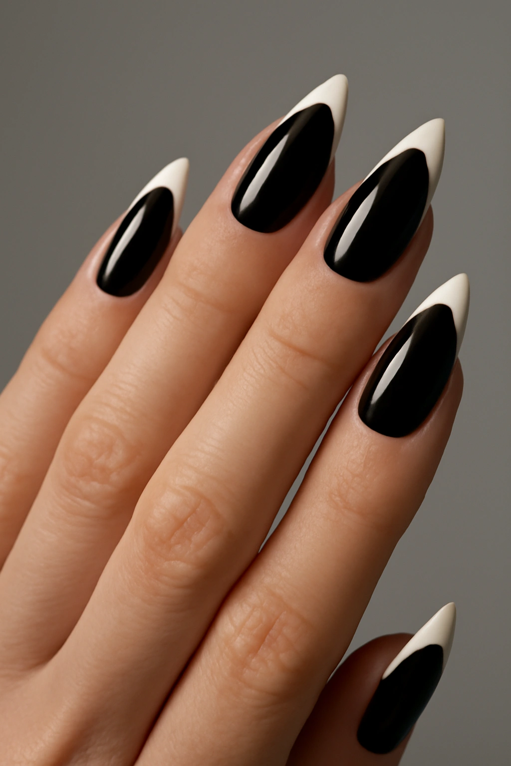 Glossy black nails with white French tips close-up