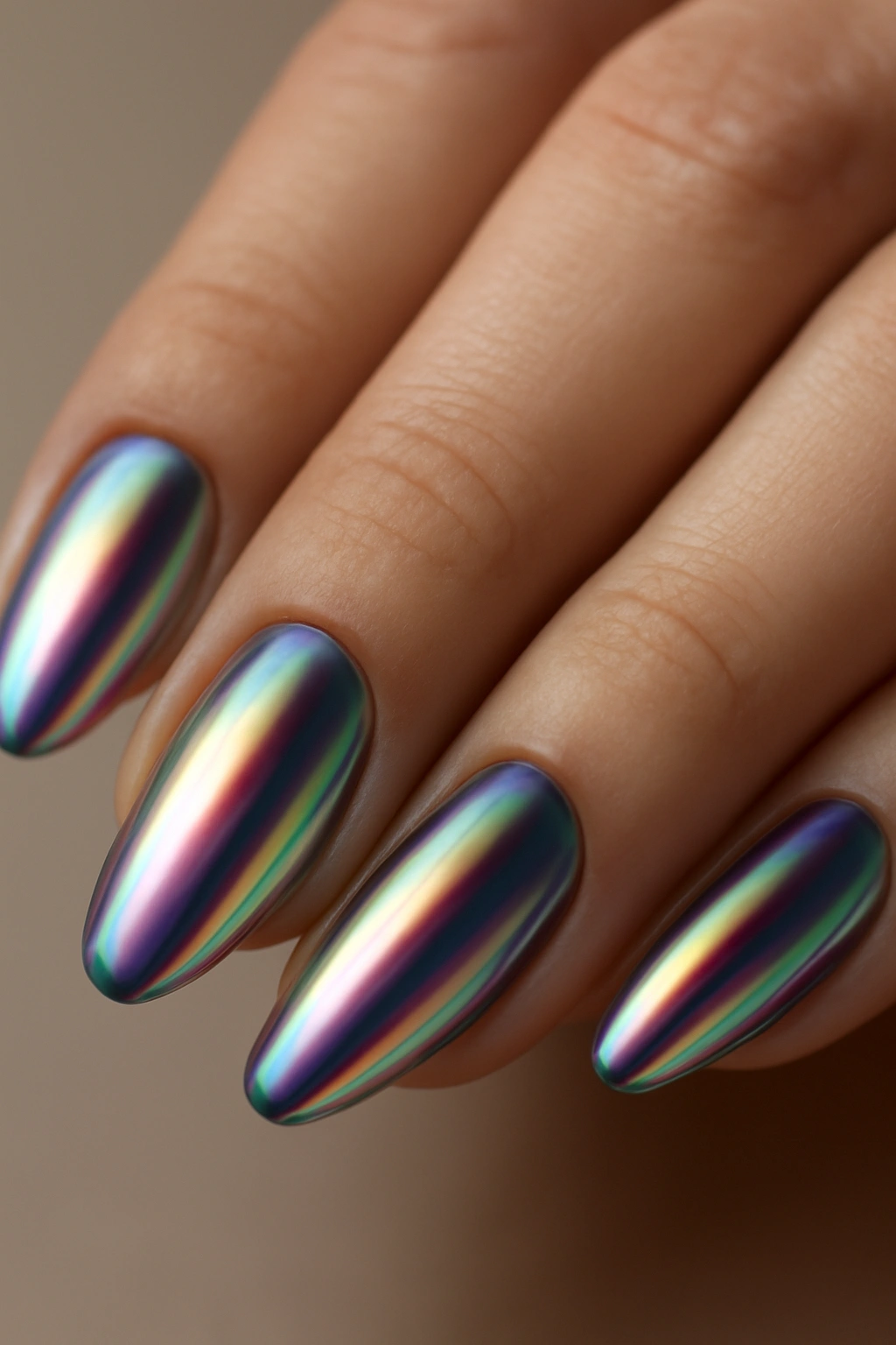 Close-up of iridescent chrome nails showing color-shifting reflections