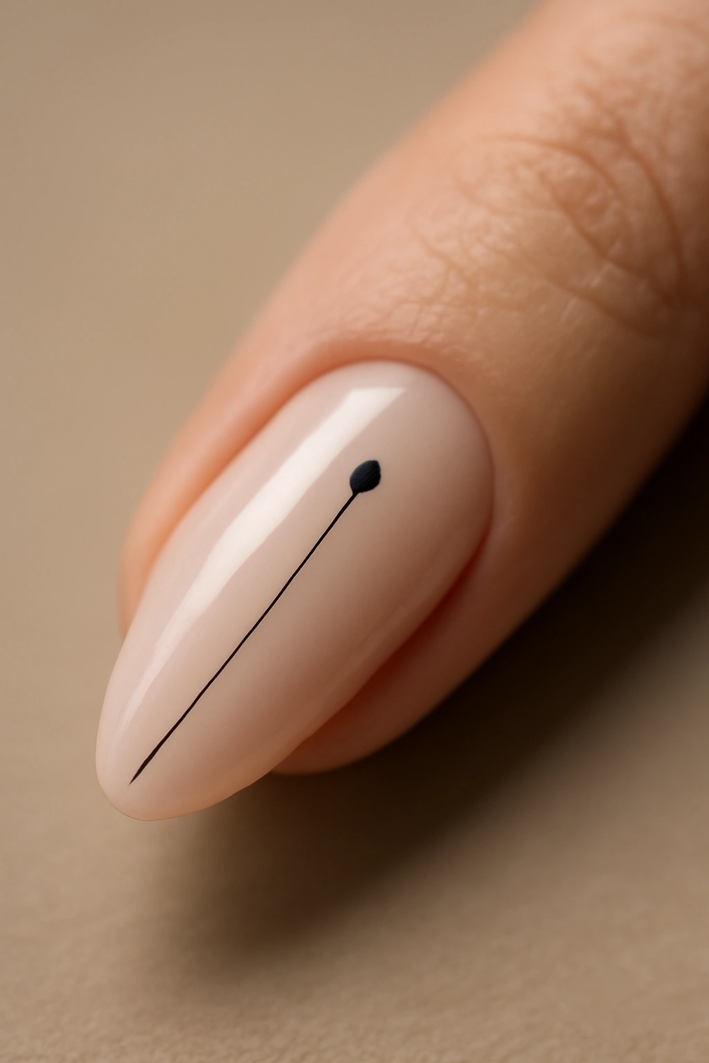 Close-up of a nail with a small dot near cuticle and a fine line toward the tip