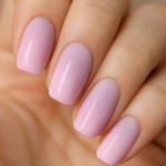 Pastel ombre nails with pink-to-lavender gradient for spring manicure.