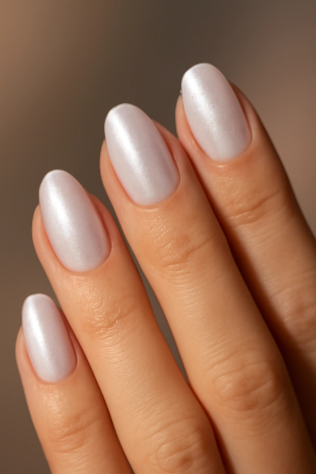 Nails with soft iridescent pearlescent glow on nude base