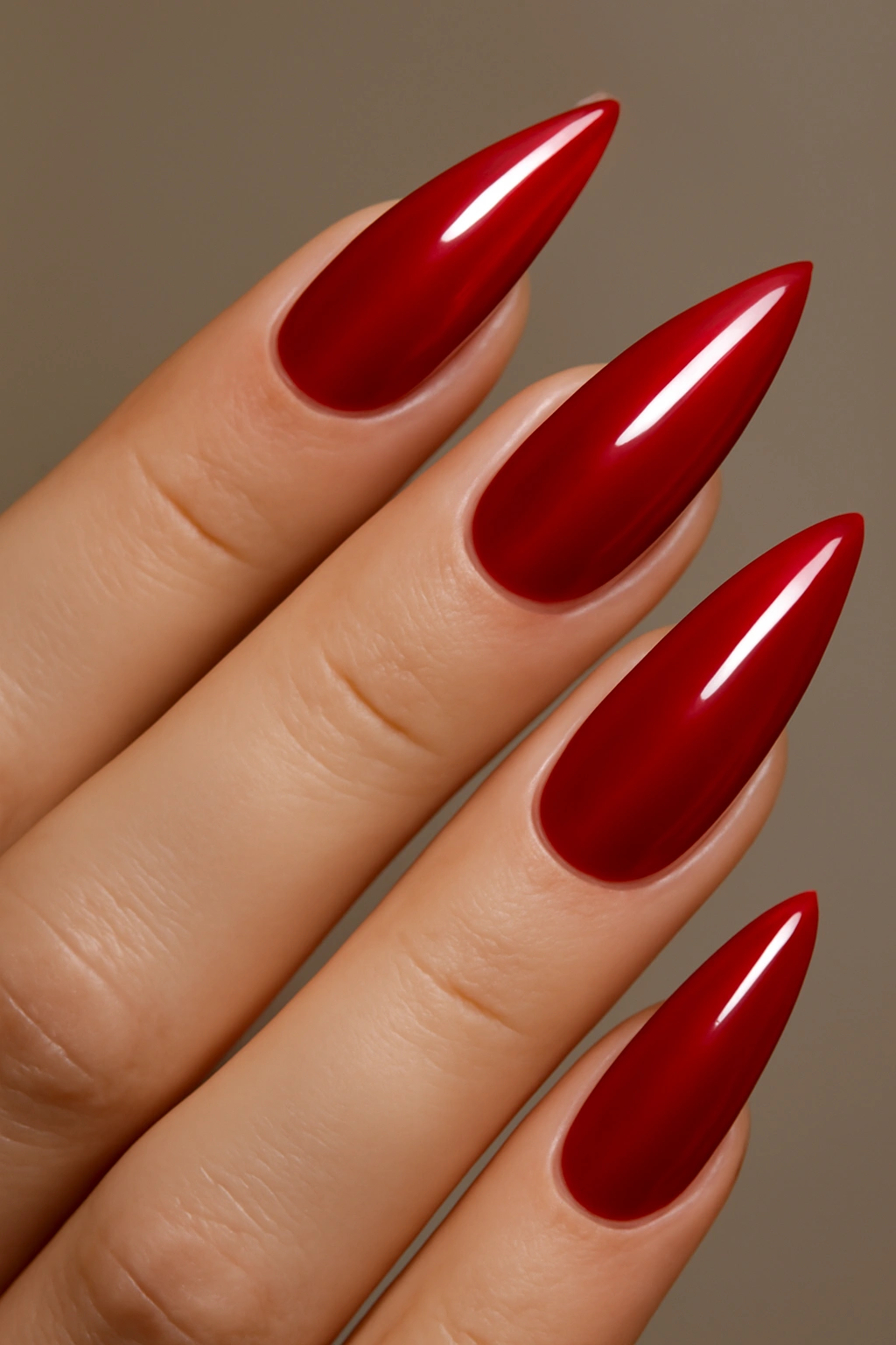 Almond-shaped nails in glossy deep red